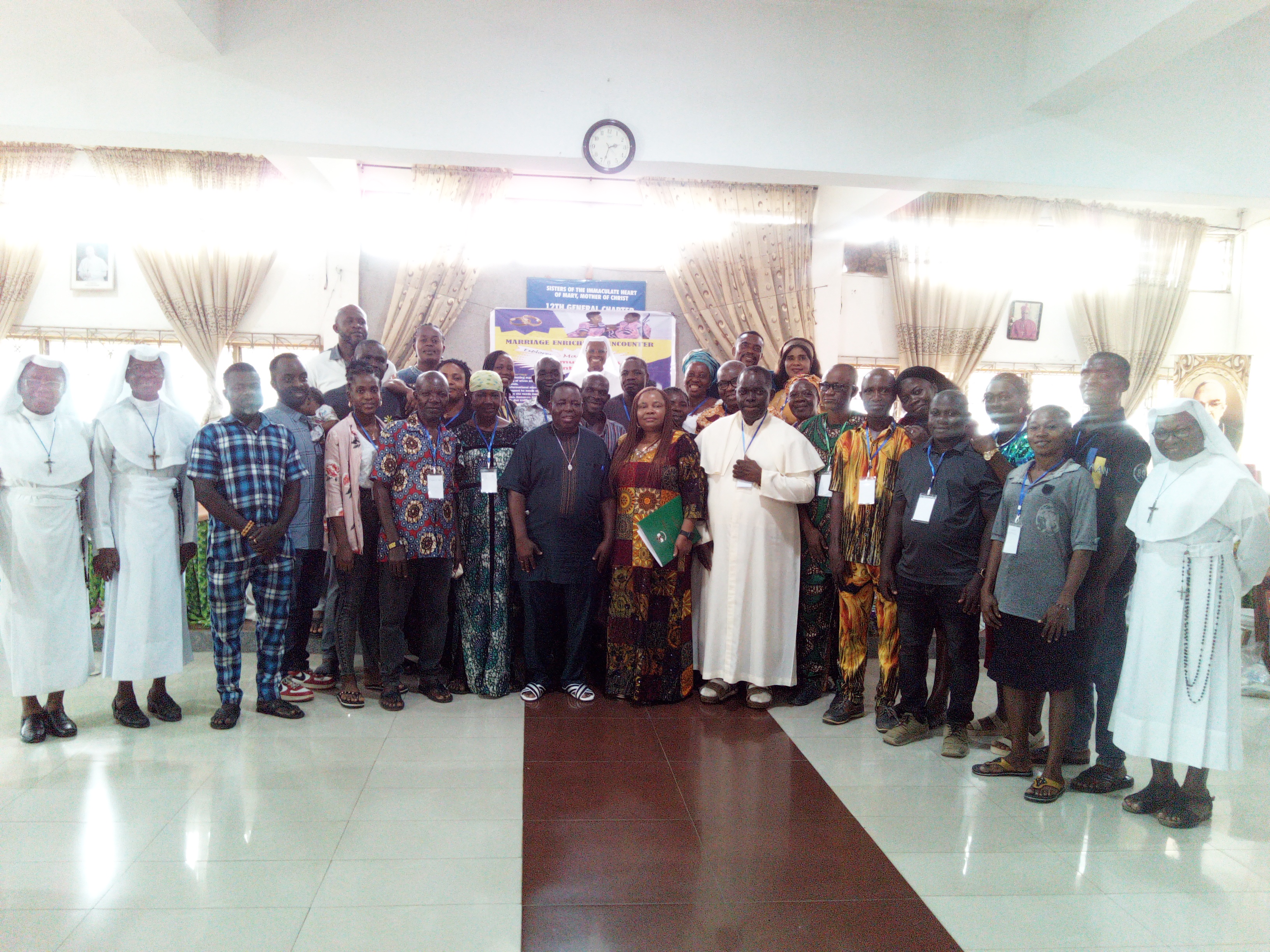 Group picture of the couples with Rev Fr. Anthony Asoanya